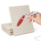 Hand punching one of the Blue Pencil Pot mini canvases