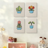 The four Blue Planter Blooms mini canvases on a wall above a shelf