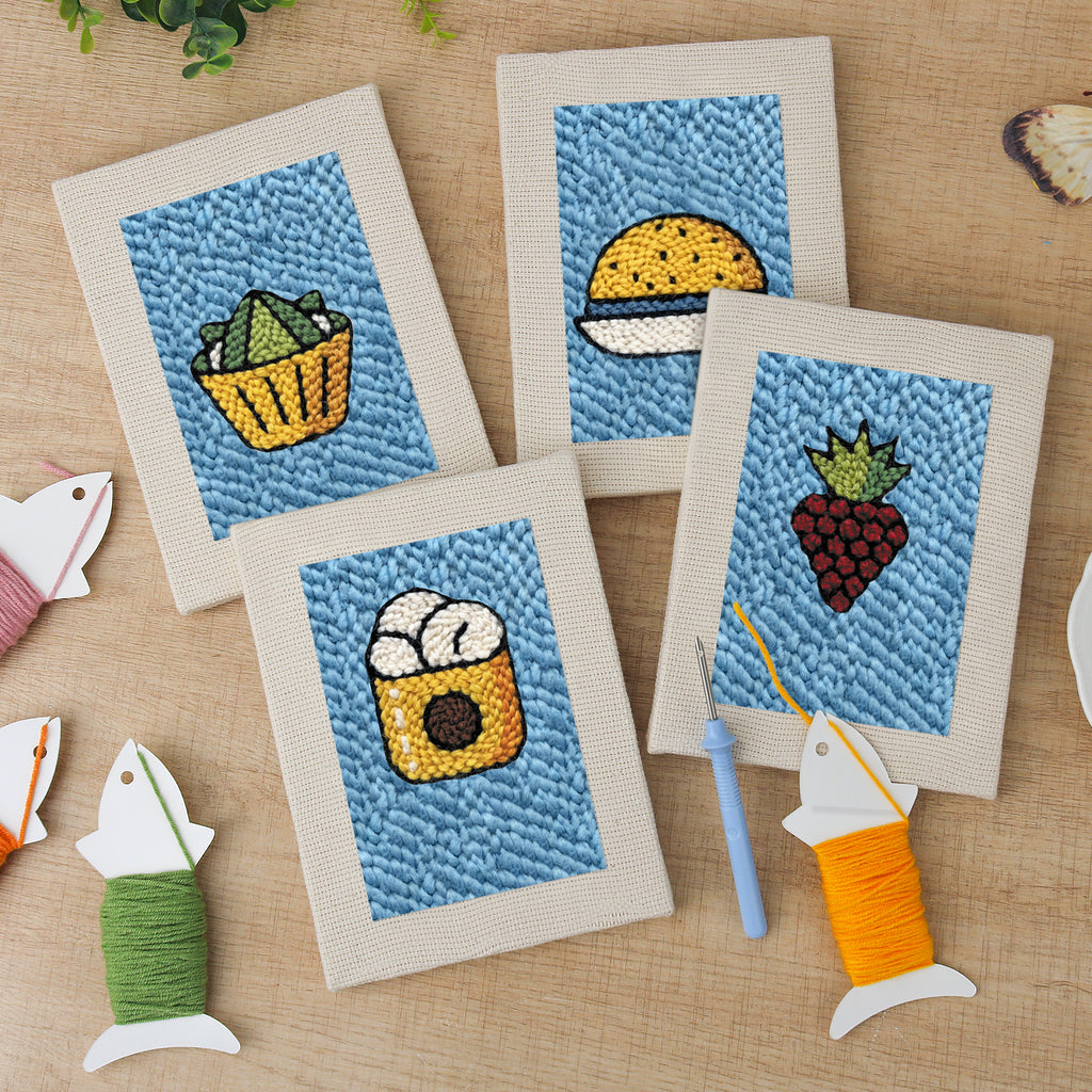 The four finished Blue Plate Snacks mini canvases laid out on a table