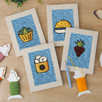 The four finished Blue Plate Snacks mini canvases laid out on a table
