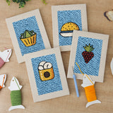 The four finished Blue Plate Snacks mini canvases laid out on a table