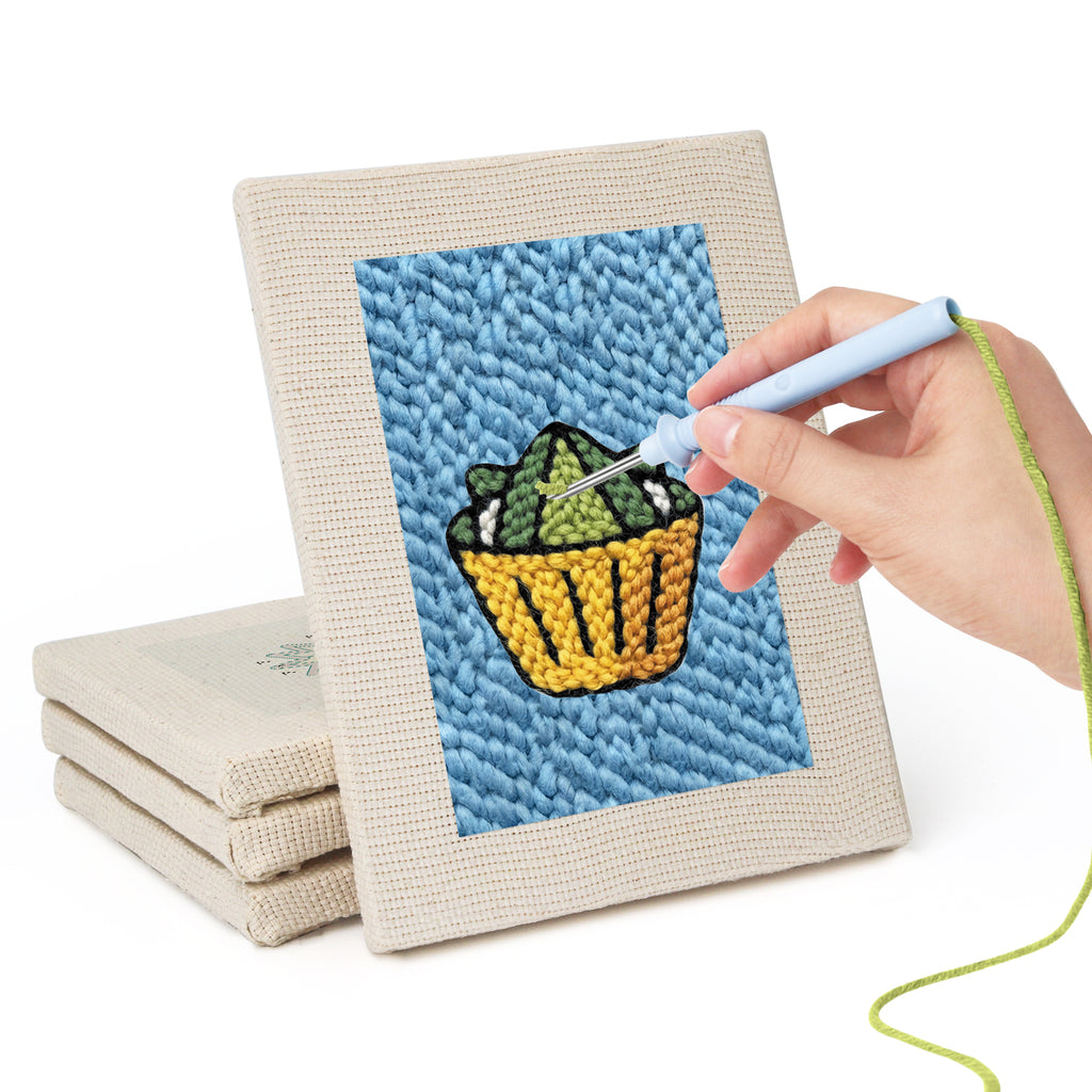 Hand punching one of the Blue Plate Snacks mini canvases