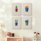 The four Blue Pot Cacti mini canvases on a wall above a shelf