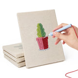 Hand punching one of the Blue Pot Cacti mini canvases