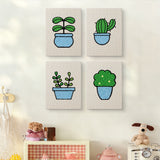 The four Blue Pot Greens mini canvases on a wall above a shelf