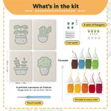 What is in the Blue Pot Greens set, 8 × 12 in (20 × 30 cm) each: 4 printed canvases, punch needle, threader, threads, color guide and 4 sets of hangers