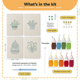 What is in the Blue Pot Houseplants set: 4 printed canvases, punch needle, threader, threads, color guide and 4 sets of hangers (6 × 8 in (15 × 20 cm) each)