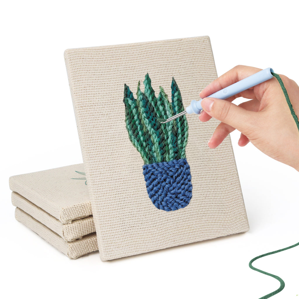 Hand punching one of the Blue Yellow Planters mini canvases