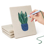Hand punching one of the Blue Yellow Planters mini canvases
