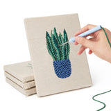 Hand punching one of the Blue Yellow Planters mini canvases
