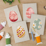 The four finished Blush Easter Eggs mini canvases laid out on a table