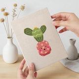 Hand holding a finished Blushing Coral Pots mini canvas
