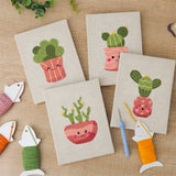 The four finished Blushing Coral Pots mini canvases laid out on a table