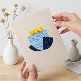 Hand holding a finished Bold Flower Heads mini canvas