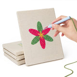Hand punching one of the Bold Flower Heads mini canvases