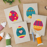 The four finished Bold Pattern Eggs mini canvases laid out on a table
