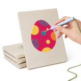 Hand punching one of the Bold Pattern Eggs mini canvases