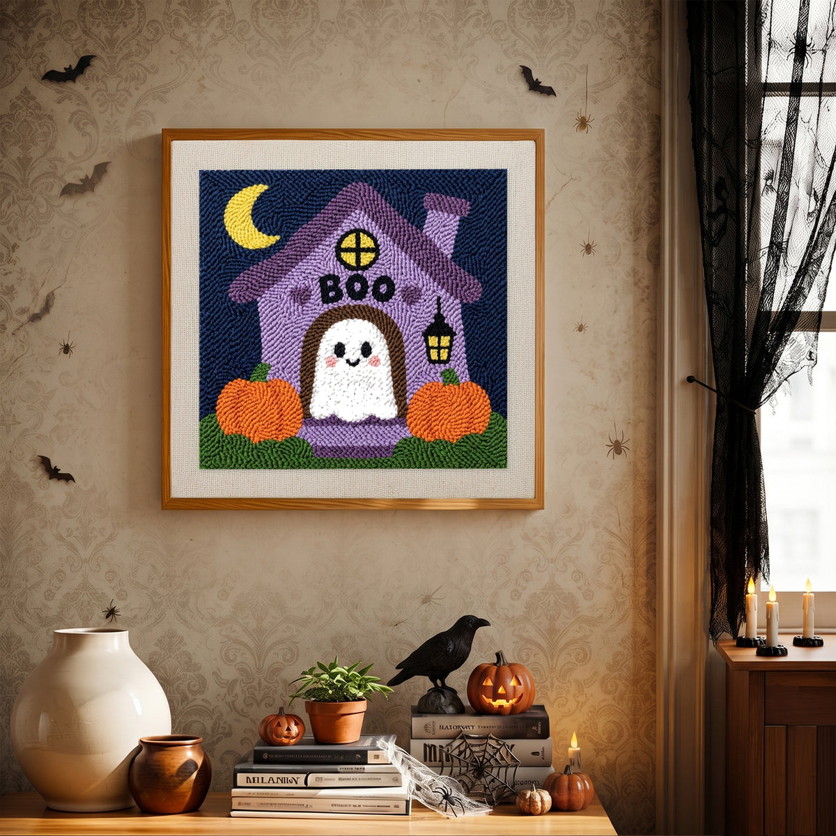 Finished Boo House Ghost punch needle canvas on a wall