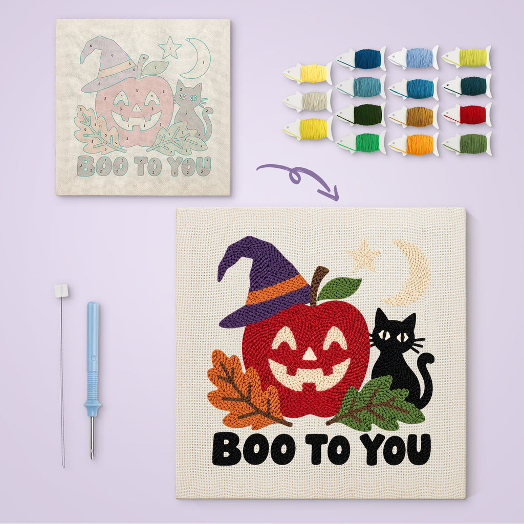 Boo to You Apple canvas before and after punching, with the threads and tools