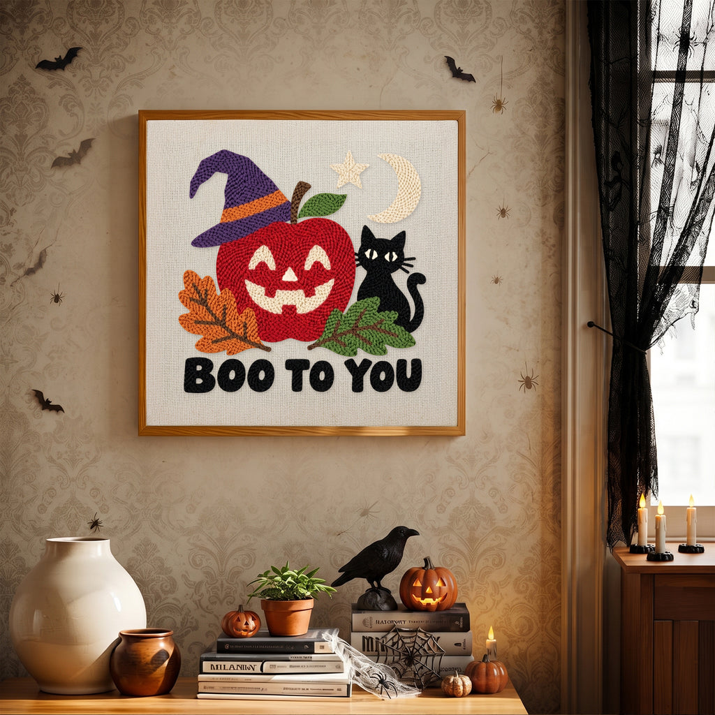 Finished Boo to You Apple punch needle canvas on a wall