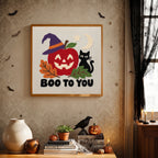 Finished Boo to You Apple punch needle canvas on a wall
