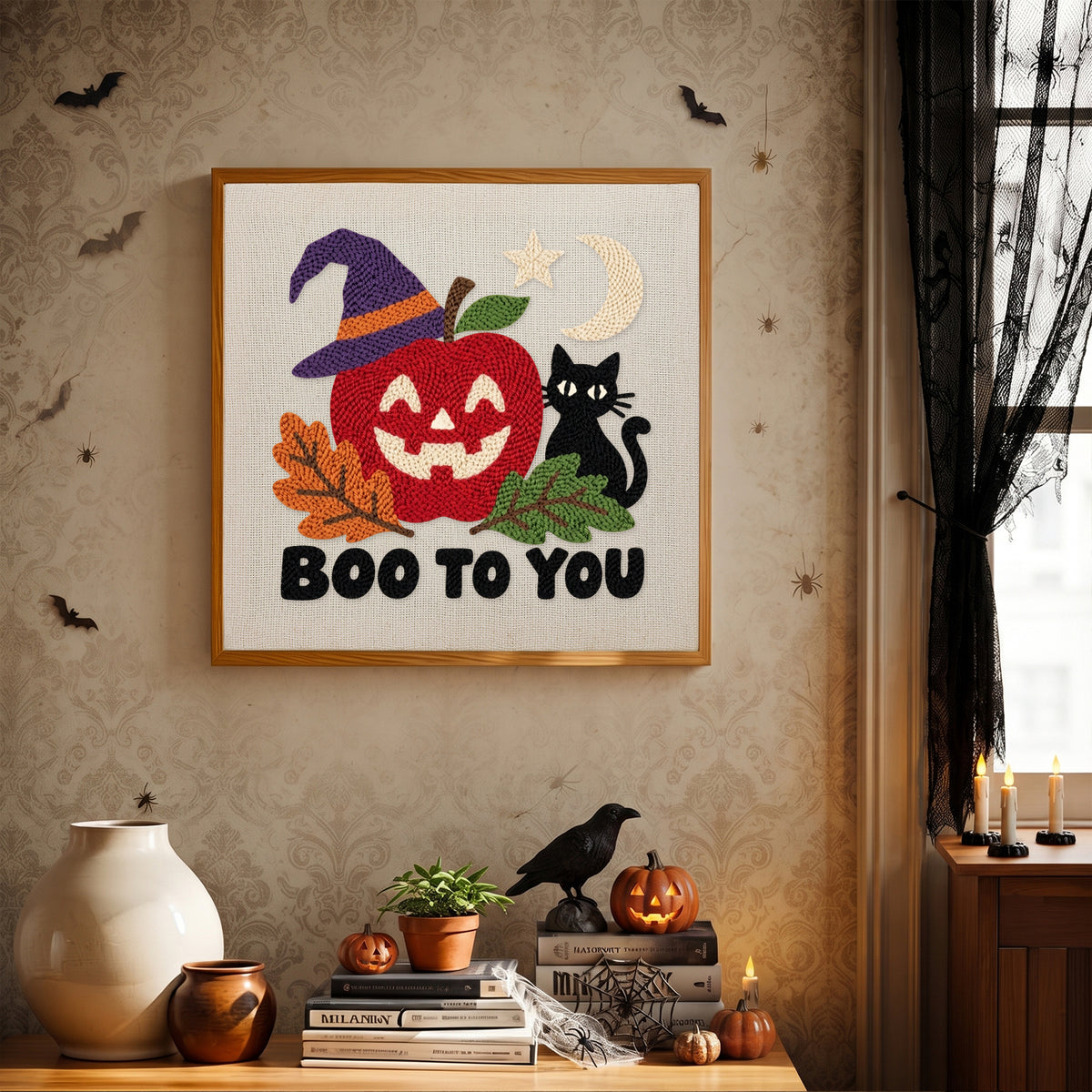 Finished Boo to You Apple punch needle canvas on a wall