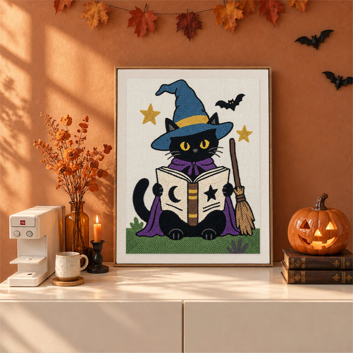 Finished Bookish Witch Cat punch needle canvas on a wall
