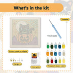 What is in the Bow Tie Cat on a Pumpkin kit: printed canvas, punch needle, threader, threads, color guide and hangers