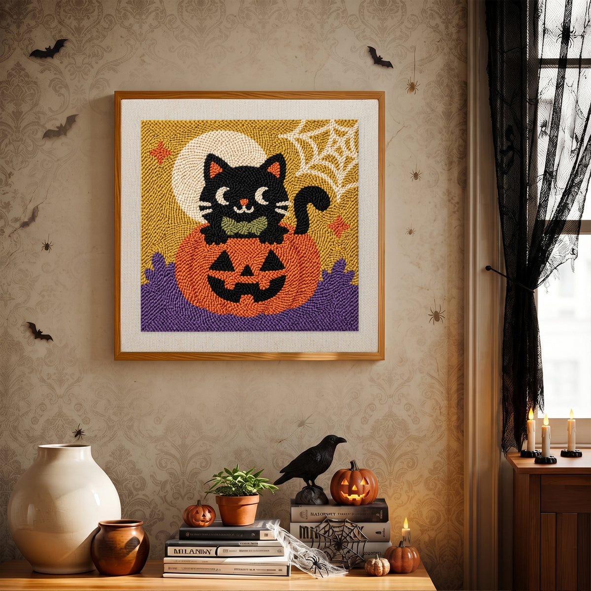 Finished Bow Tie Cat on a Pumpkin punch needle canvas on a wall