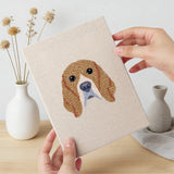 Hand holding a finished Boxer and Labrador mini canvas