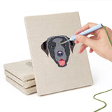 Hand punching one of the Boxer and Labrador mini canvases