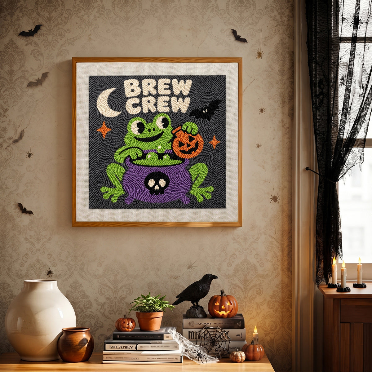 Finished Brew Crew Frog punch needle canvas on a wall