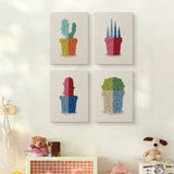The four Bright Pot Cacti mini canvases on a wall above a shelf