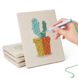 Hand punching one of the Bright Pot Cacti mini canvases