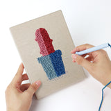 Punching a Bright Pot Cacti mini canvas with the punch needle