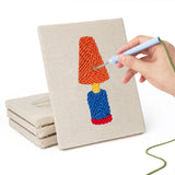 Hand punching one of the Bright Retro Lamps mini canvases