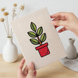 Hand holding a finished Bright Vase Plants mini canvas