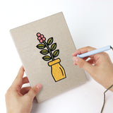 Punching a Bright Vase Plants mini canvas with the punch needle