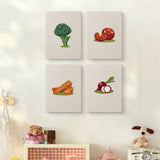 The four Broccoli Radish Bunch mini canvases on a wall above a shelf