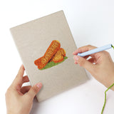 Punching a Broccoli Radish Bunch mini canvas with the punch needle