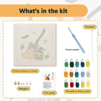 What is in the Broom and Pumpkin kit: printed canvas, punch needle, threader, threads, color guide and hangers