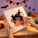 Punching the Broom and Pumpkin design with the punch needle
