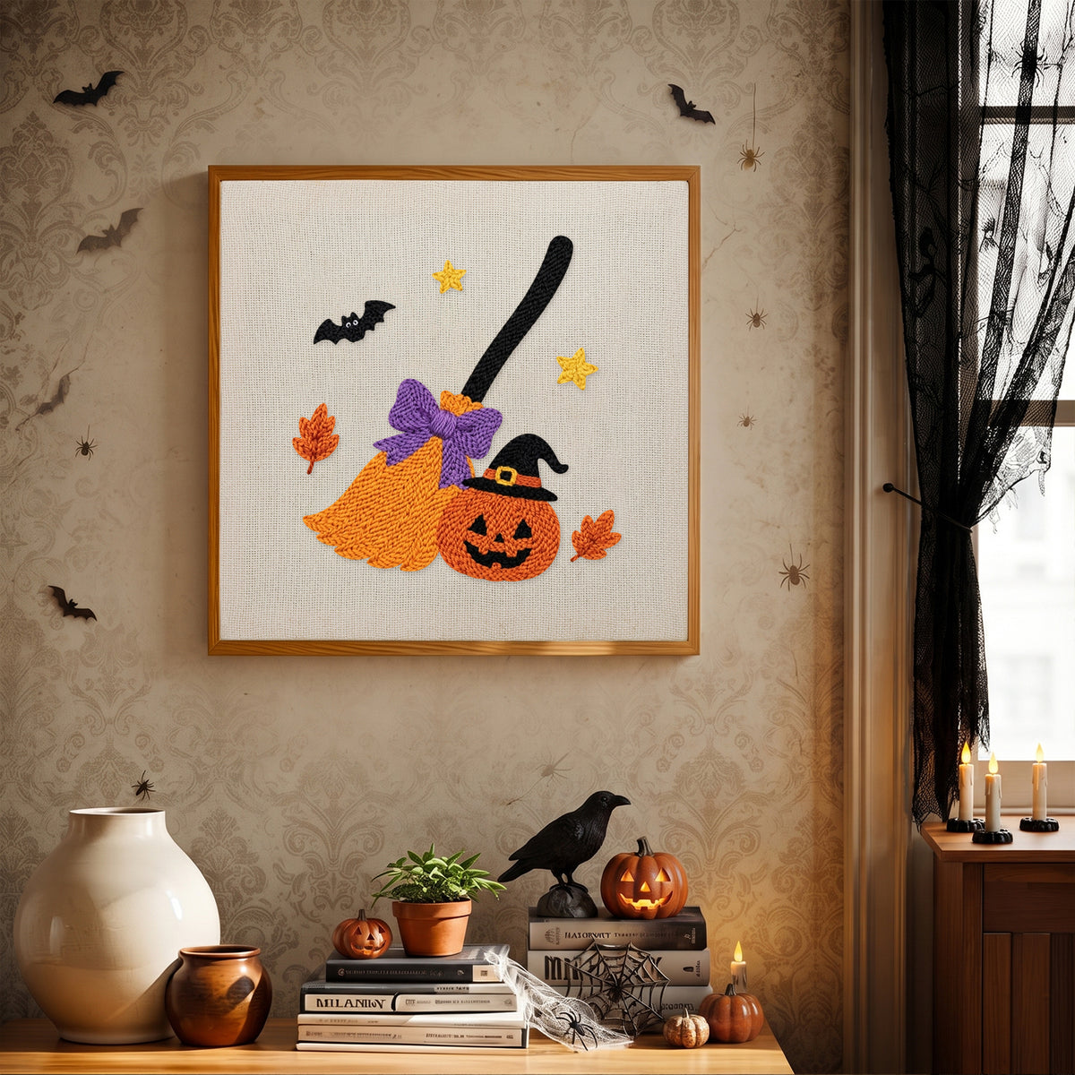Finished Broom and Pumpkin punch needle canvas on a wall