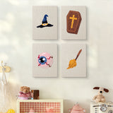 The four Broomstick and Hat mini canvases on a wall above a shelf