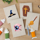 The four finished Broomstick and Hat mini canvases laid out on a table