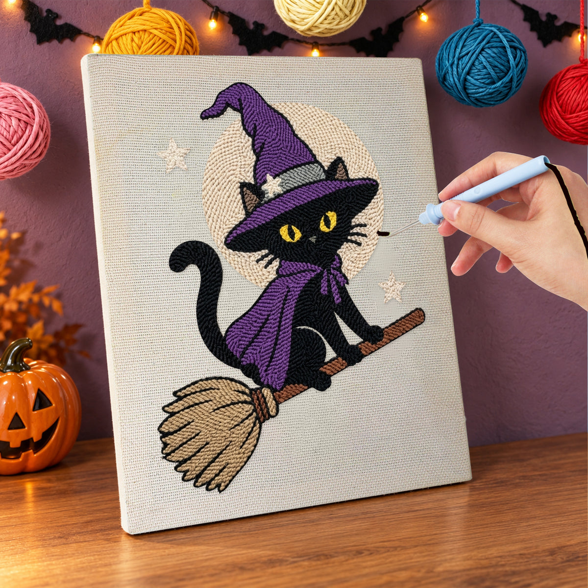 Punching the Broomstick Cat in Purple design with the punch needle