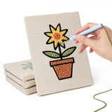 Hand punching one of the Brown Pot Blooms mini canvases