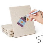 Hand punching one of the Brush Mug Crafts mini canvases