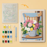 Bucket Bouquet canvas before and after punching, with the threads and tools