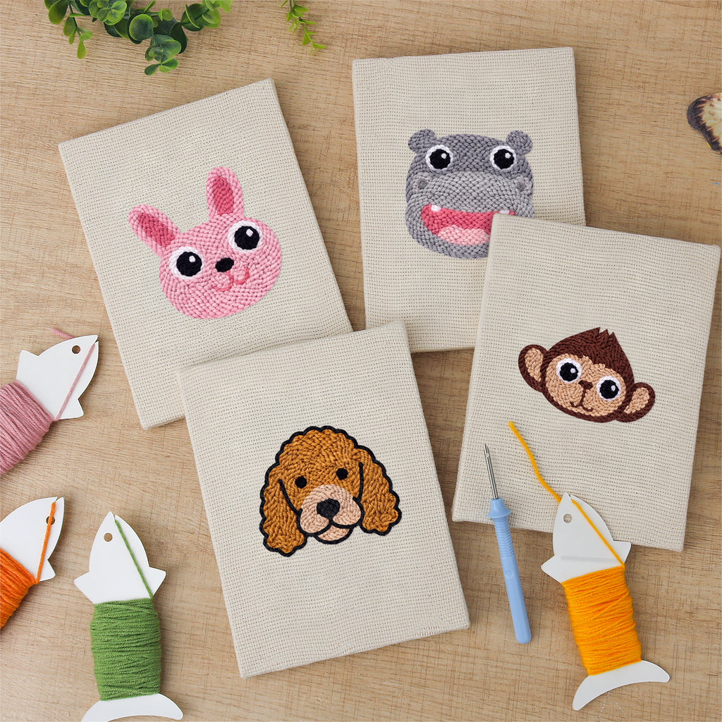 The four finished Bunny and Hippo mini canvases laid out on a table
